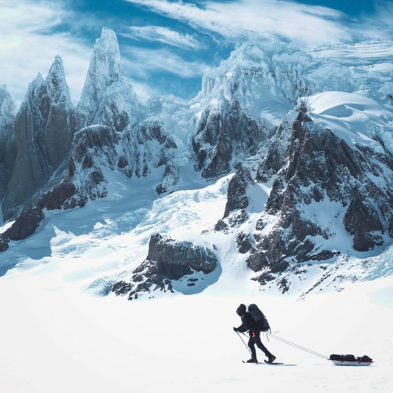 Sledge hauling below Cerro Torre and Cerro Adela