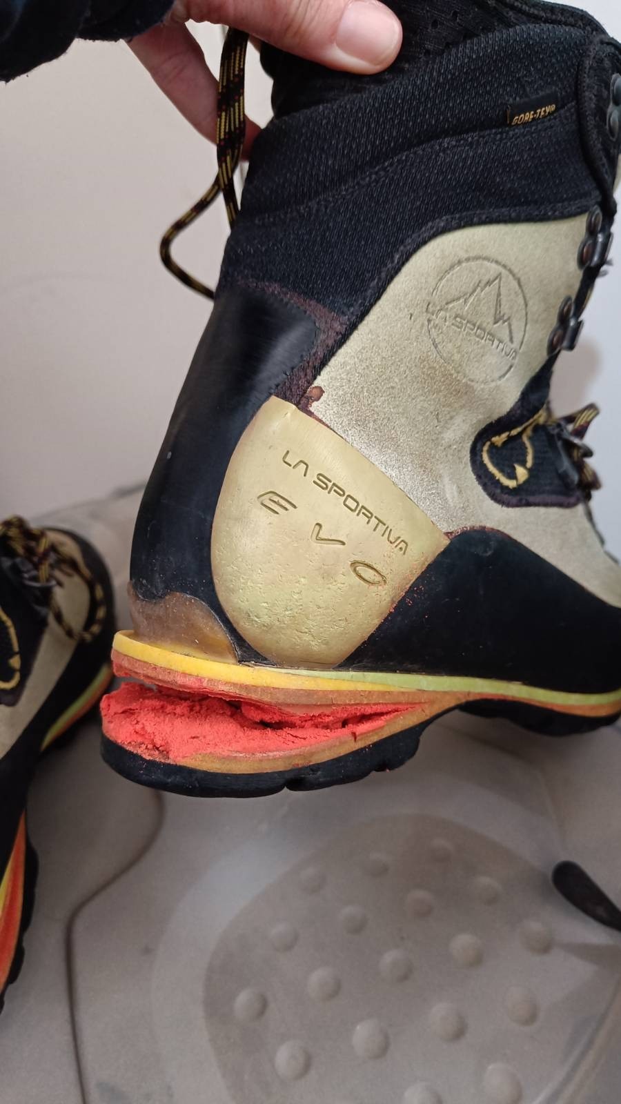 Picture of a La Sportiva Nepal Evo winter mountaineering boot with the soul breaking away. 